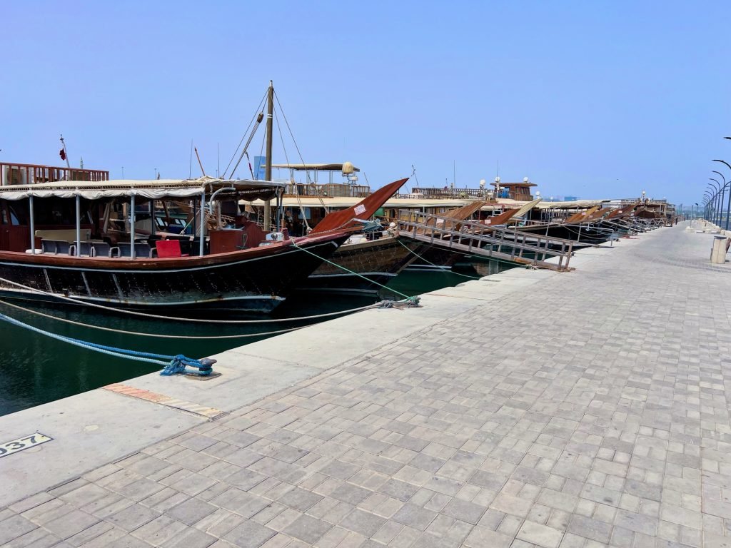 A photo of Dhow boats inside the Dhow Harbour in Doha