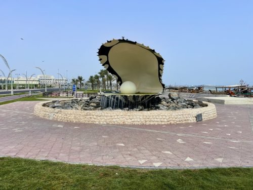 A photo of The Pearl Monument at the entrance to Dhow Harbour