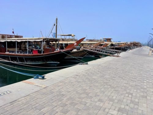 A photo of Dhow boats inside the Dhow Harbour in Doha